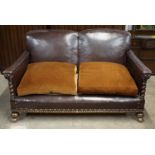 An imposing late 19th / early 20th Century hide upholstered oak three-piece suite