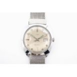 A 1960s Timex automatic wristwatch, having a chromium plated water resistant tonneau shaped case,