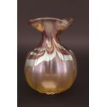 A 20th Century Loetz style lustre vase, of organic form, with pinched neck and wavy everted rim,