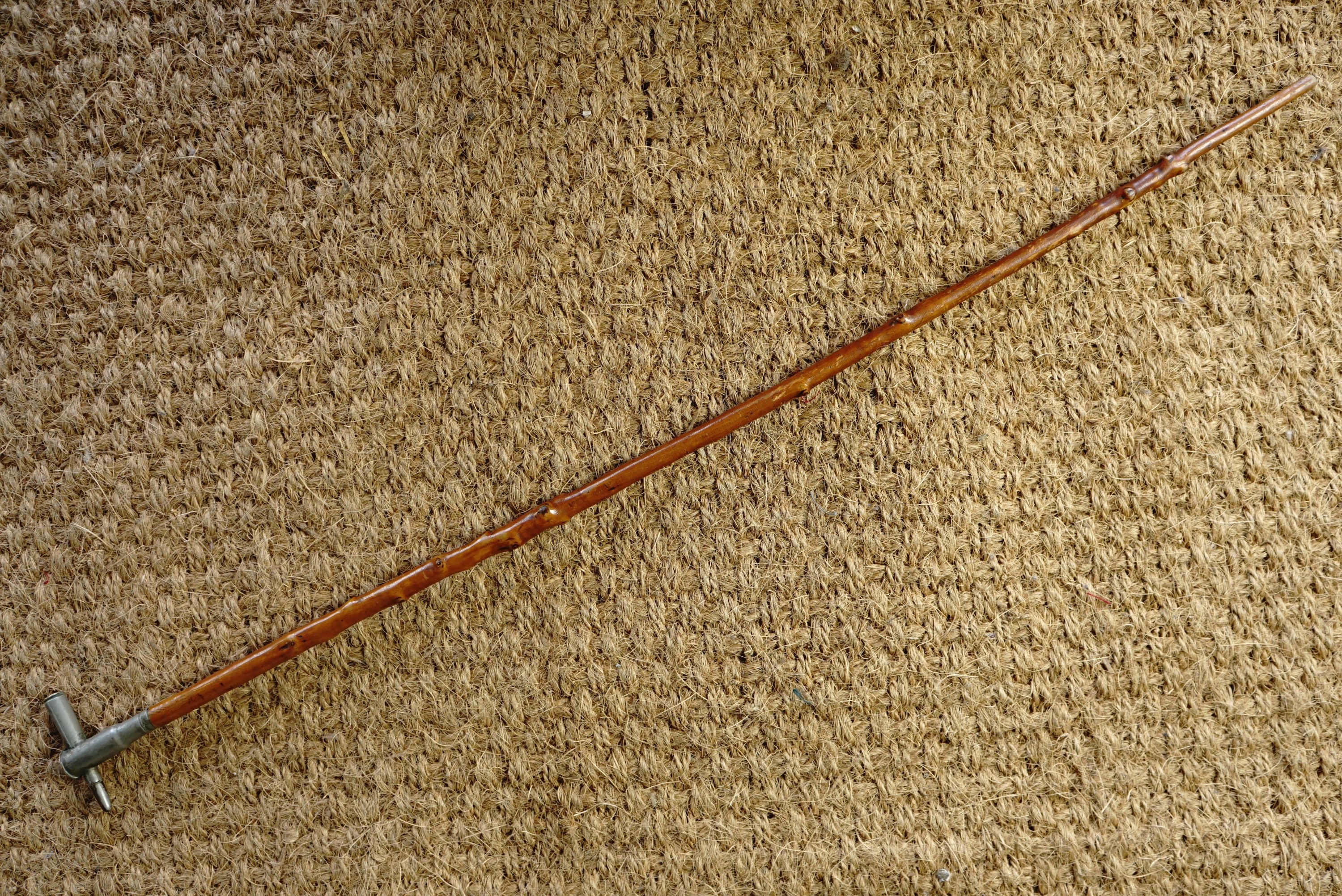 A Boer War swagger cane, its pommel fabricated from an 1899 Mauser cartridge and a British army .577