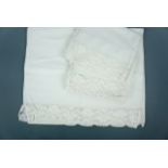 A set of antique cotton pillowcases, comprising bolster case and two matching pillow cases, each