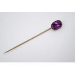 An antique pink sapphire and rose yellow-metal stick pin