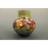 A Moorcroft vase, of compressed baluster form with a subtly everted cylindrical neck, decorated with