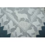 A Victorian linen tea table cloth with crochet lace border depicting stag and cattle, 140 x 140 cm