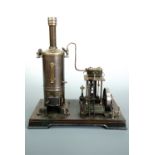 A Doll twin cylinder vertical live steam engine, circa 1910 - 1920