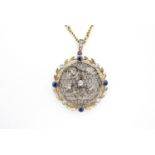 A Belle Epoque sapphire and diamond sentimental pendant