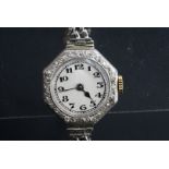An early 20th Century lady's diamond-set wristlet watch, having a Swiss movement in a high carat