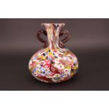 A Murano type murrine glass bottle vase, having a pair of trailing glass handles, 15 cm