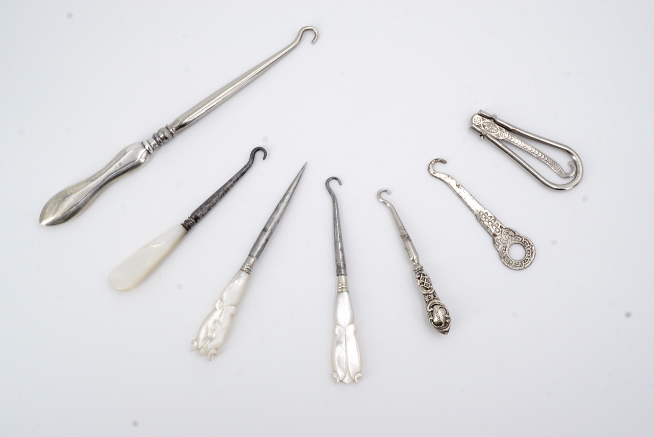 Victorian silver handled and other button hooks, two having silver assay marks, one rubbed, one