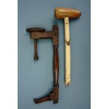 A vintage wooden bossing mallet and one other wooden tool