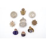 A group of Second World War Home Front and other insignia including a silver ARP badge and two
