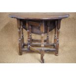 An early 18th Century joined-oak gate leg table of diminutive stature, 90 × 91 × 67 cm high