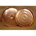 Two large copper trays, 68 cm and 66 cm diameter