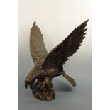 A large and impressive bronze patinated cast iron sculpture of an eagle, 60 cm high (15.9 kg)