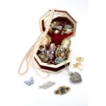 A vintage jewellery casket containing a quantity of mid 20th Century and later costume jewels,