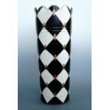 A Harlequin cream and black umbrella stand