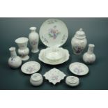 Thirteen items of Aynsley "Little Sweetheart" ware including four vases, a lidded jar, two lidded