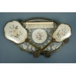 A 1940s gilt metal and embroidery dressing table set