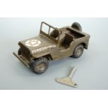 A Tri-ang clockwork jeep in U.S. Amy olive green with star decal and 2068315-S jeep number to the