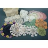 A collection of vintage handmade doilies, ornamental mats and shelf accents or edging, including