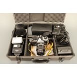 A Nikon FM2 SLR Camerachrome camera and accessories