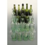 A quantity of antique glass beer bottles