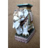 A contemporary reproduction Chinese earthenware stool modelled as an elephant, 57 cm high