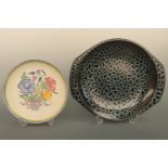 Poole Pottery dishes, comprised of a charger decorated in a blue and black resist glaze, 35 cm,