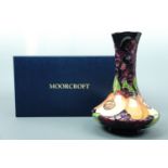 A contemporary Moorcroft "Apricots" pattern compressed baluster vase, the decoration depicting