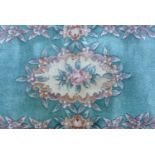 A Chapman's Siesta Collection Chinese rug, in sea green and pink, 155 x 90 cm