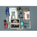 Tools including a micrometer, surface gauge, pipe cutter and pipe bender etc
