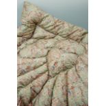 A vintage machine stitched feather eiderdown for a single bed, in a mint green paisley pattern