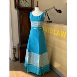 Four 1960s evening gowns, including a Blaines baby blue ruched ribbon and lace floor-length dress,