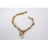 An early 20th Century 9 ct gold two-bar gate link bracelet with padlock clasp, 14 cm, 2.6 g, (a/f)