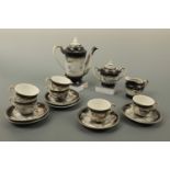 A Japanese egg shell porcelain tea set with lithophane base depicting a geisha