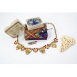 A 1930s costume jewellery, including a metal leaf necklace, white-metal tutti-frutti bar brooch, a