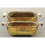 Two brass planters with delft ware handles, largest 48 cm