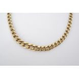 A 9ct gold graded flat curb-link neck chain, fastening on a spring ring, 43 cm in length, 10.6g