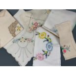 A quantity of vintage colourfully and hand-embroidered tea tray and table linens, circa 1920s