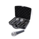 Three cased Wharfedale Pro DM 2.0 microphones