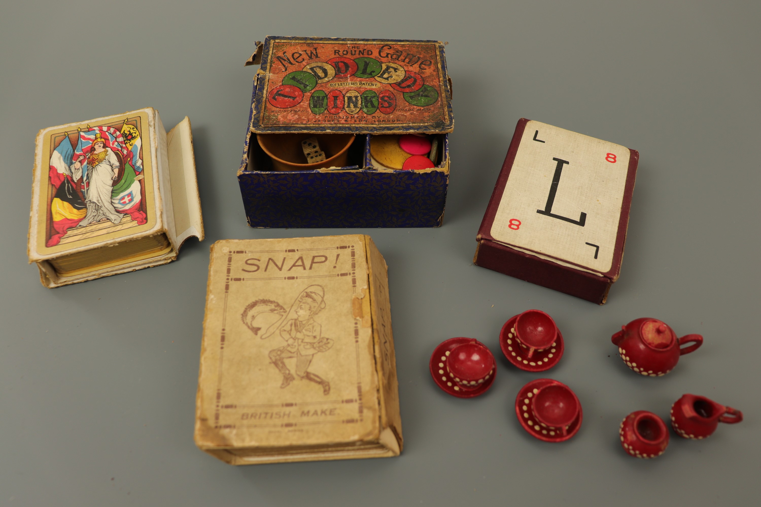 Vintage toys and games, including a miniature tea service, a boxed game of tiddlywinks and further