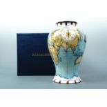 A contemporary Moorcroft limited edition inverted baluster vase, the decoration depicting passion