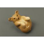 A vintage WR Midwinter bear cub modelled in a playful roll, third quarter 20th Century, 8 × 5 cm