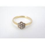 A yellow metal cluster ring, marked 18 ct, (a/f), M, 1.5 g