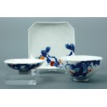 A Japanese porcelain tea bowl and two dishes