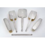 An early George VI silver dressing table mirror and brush set, of Art Deco design, comprising two