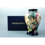 A contemporary Moorcroft 'Golden Jubilee" inverted baluster vase, the decoration depicting spring