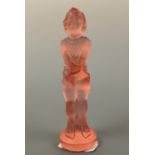 A 1930s pressed pink glass figure of a young girl, 13.5 cm