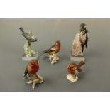 Five Hummel bird figurines including a bullfinch, robin, blue tit and woodpecker (woodpecker a/f)