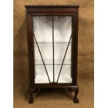 A 1930s glazed oak display cabinet, of diminutive stature, 59 cm x 29 cm x 116 cm